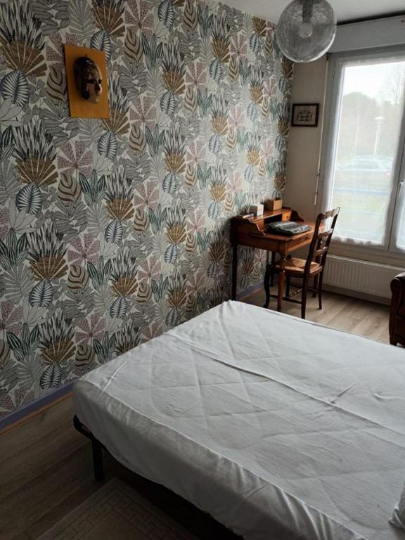Posteľ alebo postele v izbe v ubytovaní L'Intemporel - Appartement T3 avec jardinet