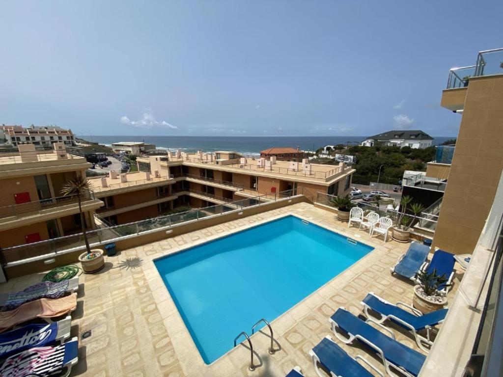 a large swimming pool on top of a building at APARTAMENTO VISTA MAR in Lourinhã