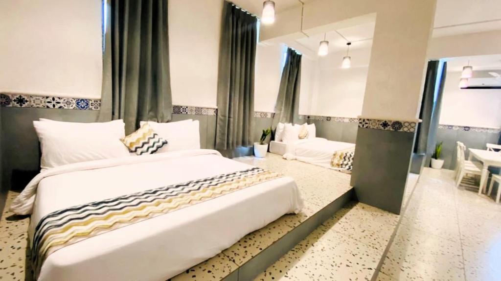 Postel nebo postele na pokoji v ubytování Nest Beacon Resort Daman