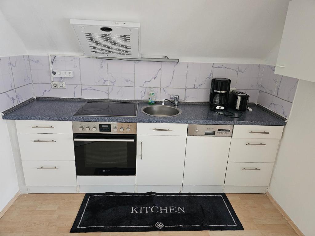 Kuchyň nebo kuchyňský kout v ubytování Ferienwohnung Attersee