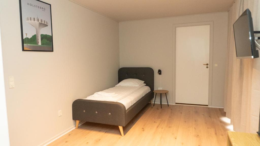Ein Bett oder Betten in einem Zimmer der Unterkunft Hotel Smedegaarden