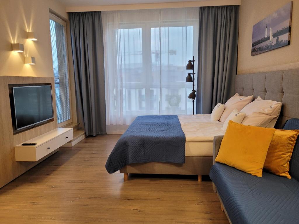 Posteľ alebo postele v izbe v ubytovaní Bel Mare Wyspa, apartament z parkingiem gratis