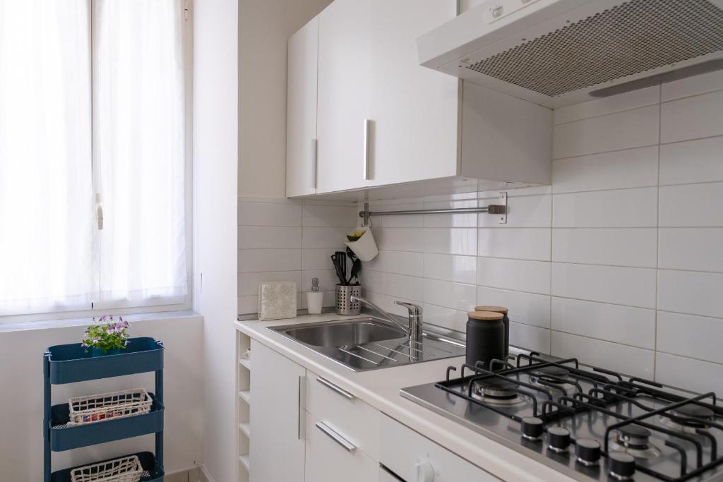 Kuchyň nebo kuchyňský kout v ubytování San Liborio Suites