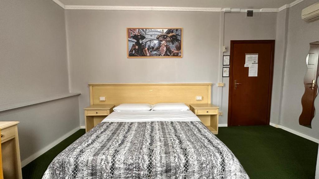 Postel nebo postele na pokoji v ubytování Nuova Locanda Belvedere