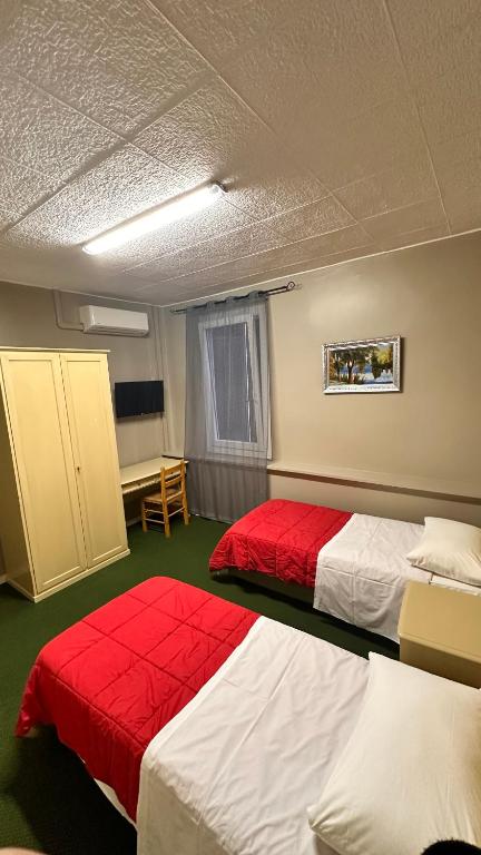 Postel nebo postele na pokoji v ubytování Nuova Locanda Belvedere