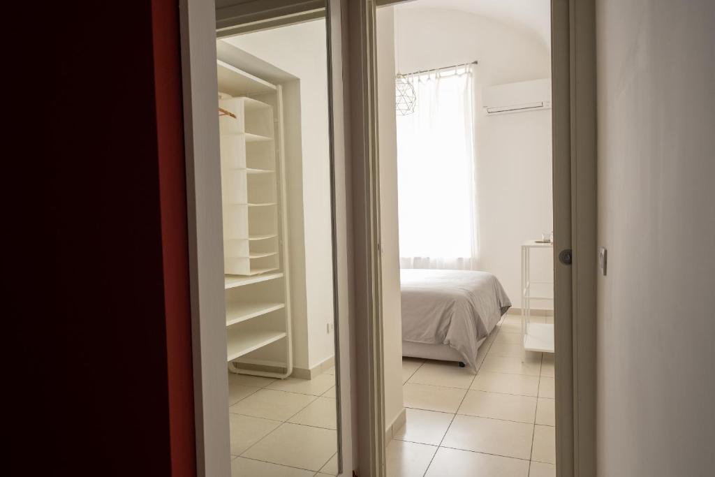 Postel nebo postele na pokoji v ubytování San Liborio Suites