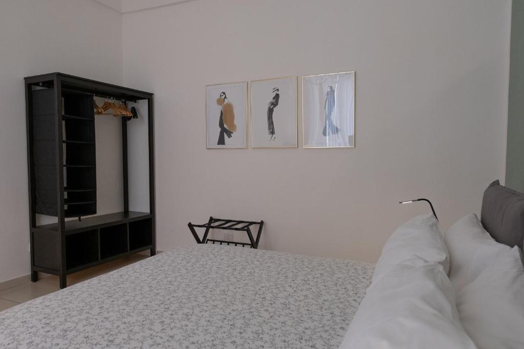 Postel nebo postele na pokoji v ubytování San Liborio Suites