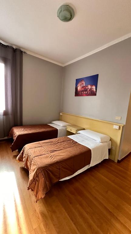 Postel nebo postele na pokoji v ubytování Nuova Locanda Belvedere