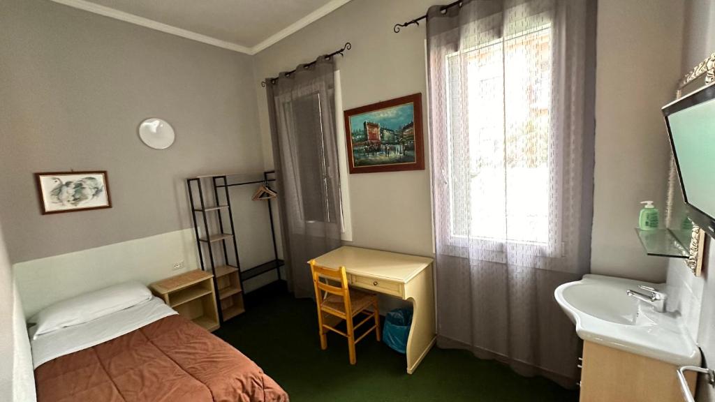 Postel nebo postele na pokoji v ubytování Nuova Locanda Belvedere