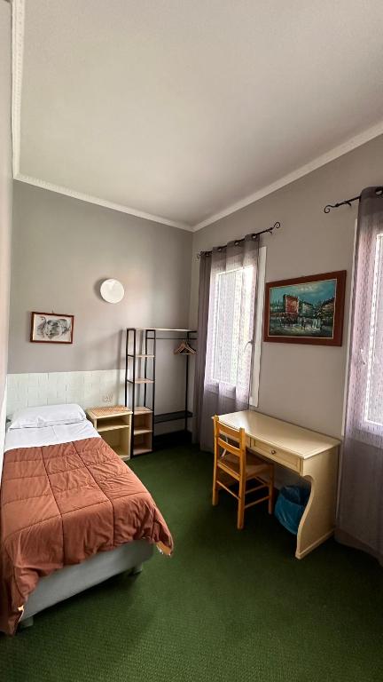 Postel nebo postele na pokoji v ubytování Nuova Locanda Belvedere