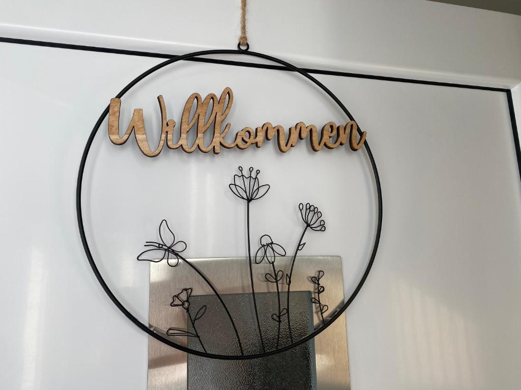 a mirror with a sign that reads wilderness at Am Kienbusch - Südliche Weinstraße - Erdgeschoss in Annweiler am Trifels