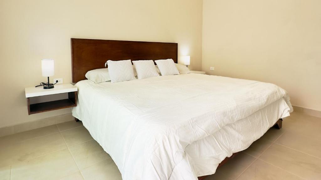 Postel nebo postele na pokoji v ubytování Villas Mar Turquesa Cozumel