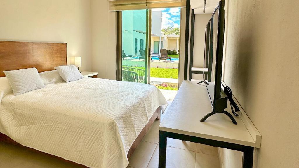 TV a/nebo společenská místnost v ubytování Villas Mar Turquesa Cozumel