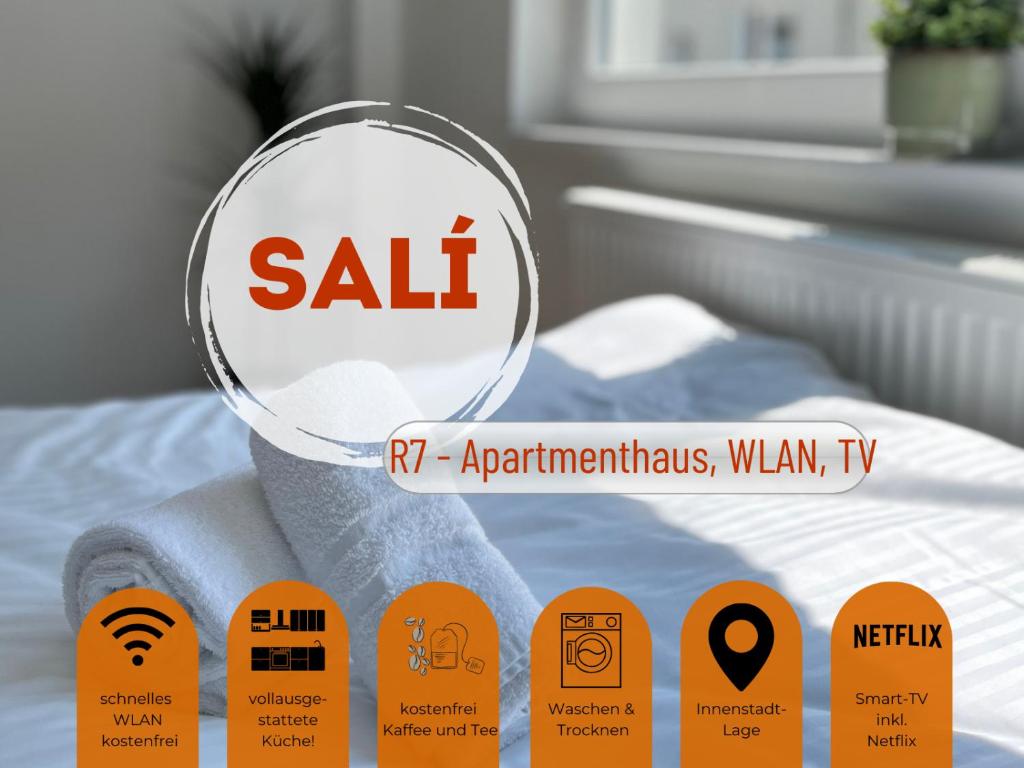 een vergrootglas op een bed bij Sali -R7-Apartmenthaus, WLAN, TV in Remscheid