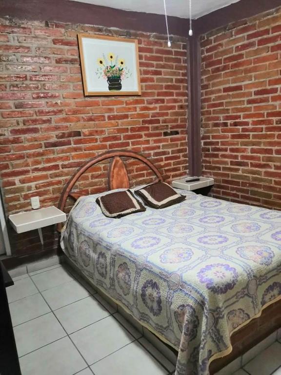 Postel nebo postele na pokoji v ubytování Hotel Villas Kerendarhú