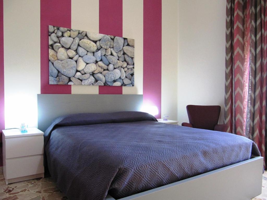 מיטה או מיטות בחדר ב-La Casa sul Corso