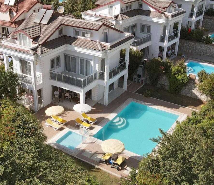 an aerial view of a house with a swimming pool at Villa Raya3 in Fethiye