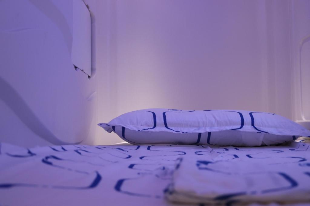 Postel nebo postele na pokoji v ubytování Pupa House - Capsule Hotel - Adults Only