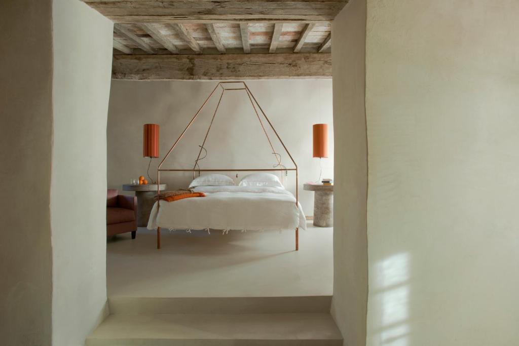 Postel nebo postele na pokoji v ubytování Monteverdi Tuscany