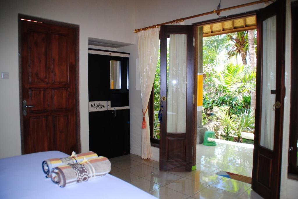 Voodi või voodid majutusasutuse Kubu Sari Guest House toas