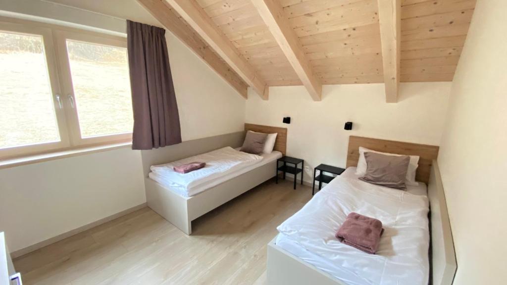 Postel nebo postele na pokoji v ubytování Chalet MIA
