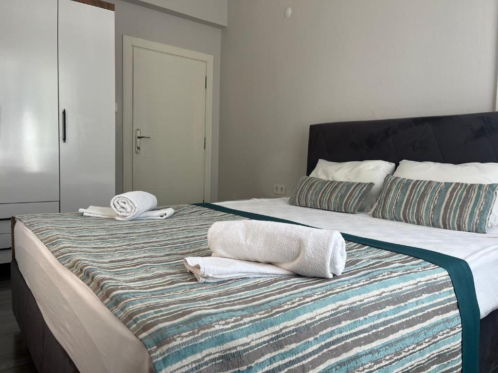 Postel nebo postele na pokoji v ubytování Kagan Holiday Apartments