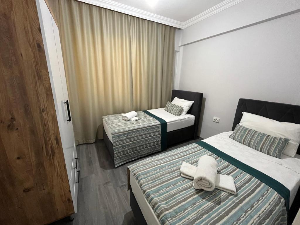 Postel nebo postele na pokoji v ubytování Kagan Holiday Apartments