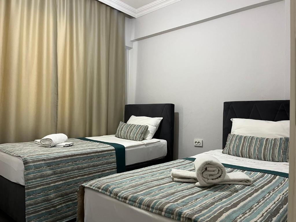 Postel nebo postele na pokoji v ubytování Kagan Holiday Apartments