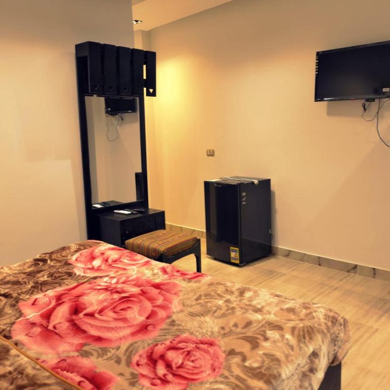 Postel nebo postele na pokoji v ubytování Summer Land Hotel