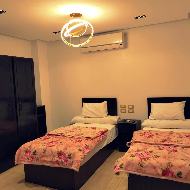 Postel nebo postele na pokoji v ubytování Summer Land Hotel