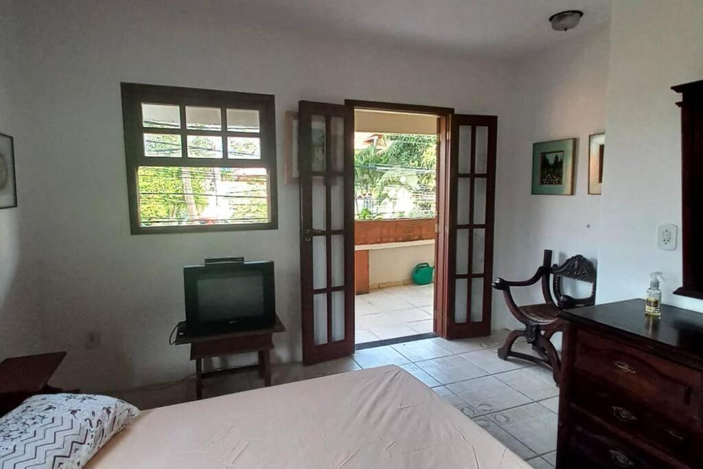 Tempat tidur dalam kamar di Espaço inteiro: casa Manguinhos/Geribá