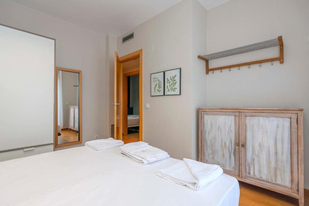 Postel nebo postele na pokoji v ubytování Modern and bright apartment in Eixample 5-1