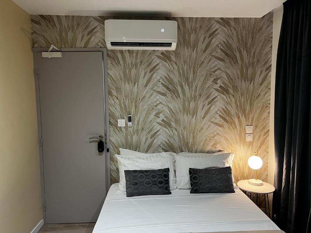 Postel nebo postele na pokoji v ubytování Chambre Musa en Colocation