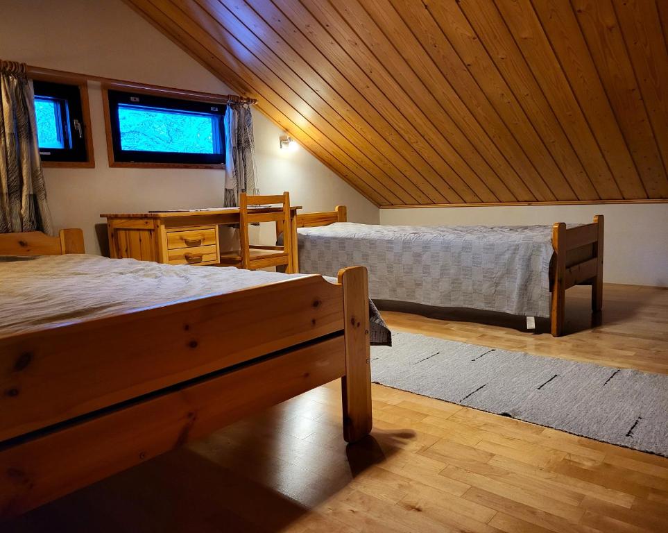 Postel nebo postele na pokoji v ubytování Mäntymajat