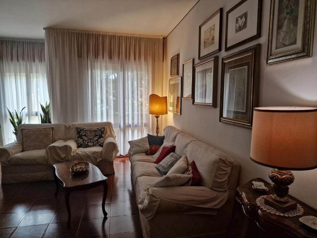 a living room with a couch and a table at Kate's house in Padova