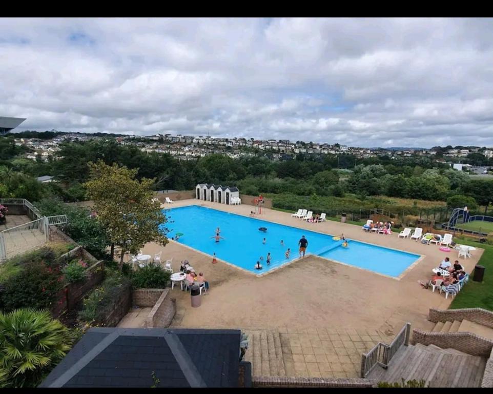 an overhead view of a large swimming pool at Sandy Toes Hoburne Devon Bay Holiday Park. in Paignton