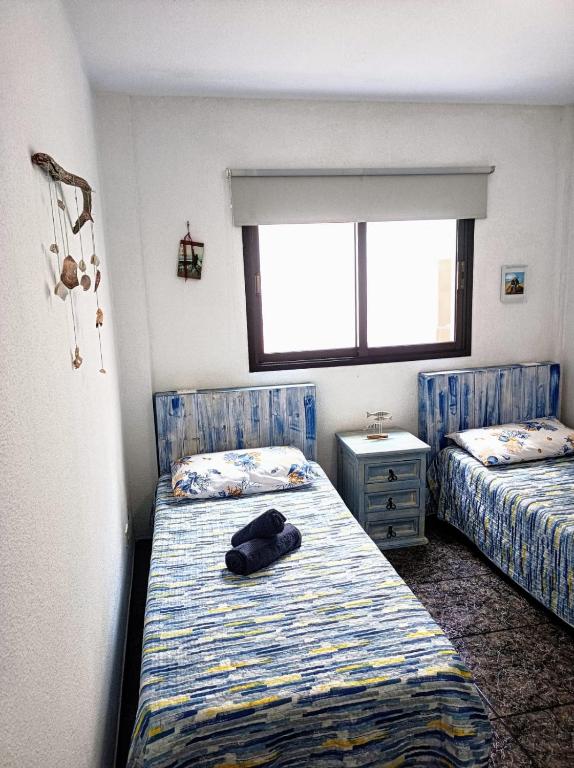 Postel nebo postele na pokoji v ubytování CASA LEO