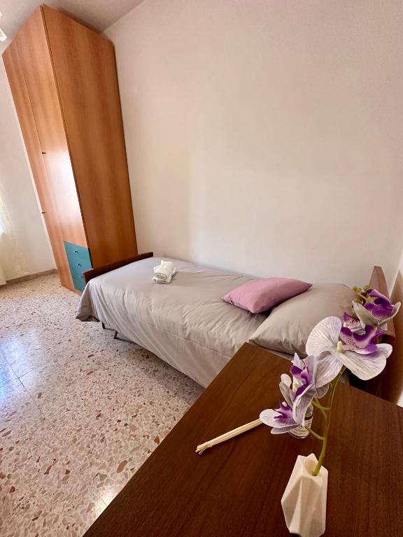 Postel nebo postele na pokoji v ubytování Affittacamere La Dimora dei Nonni