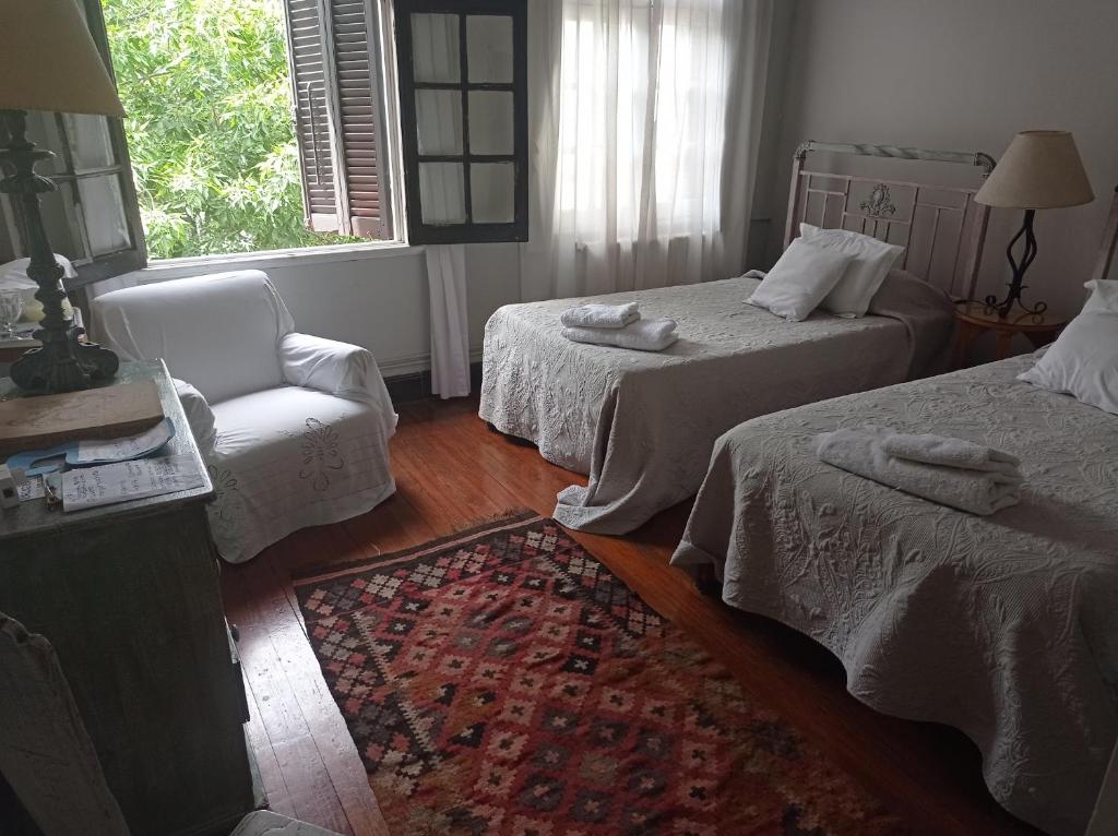 Postel nebo postele na pokoji v ubytování Casona de Estilo Inglés
