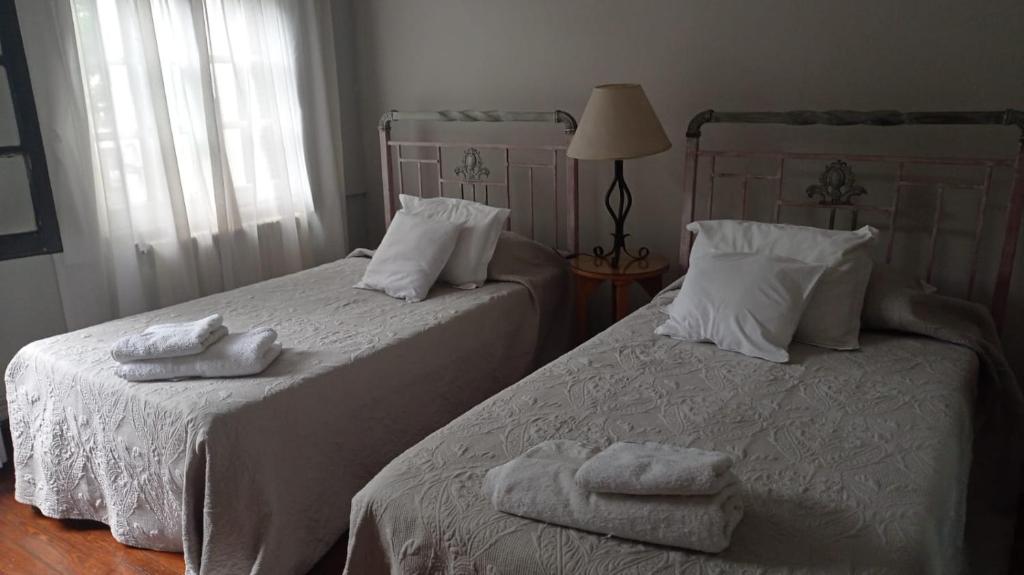Postel nebo postele na pokoji v ubytování Casona de Estilo Inglés