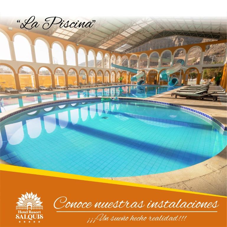 a large swimming pool in a large building at HOTEL RESORT SALQUIS in La Paz