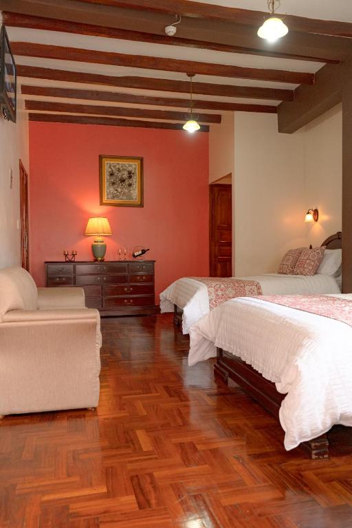 Postel nebo postele na pokoji v ubytování Rincón Familiar Hostel Boutique