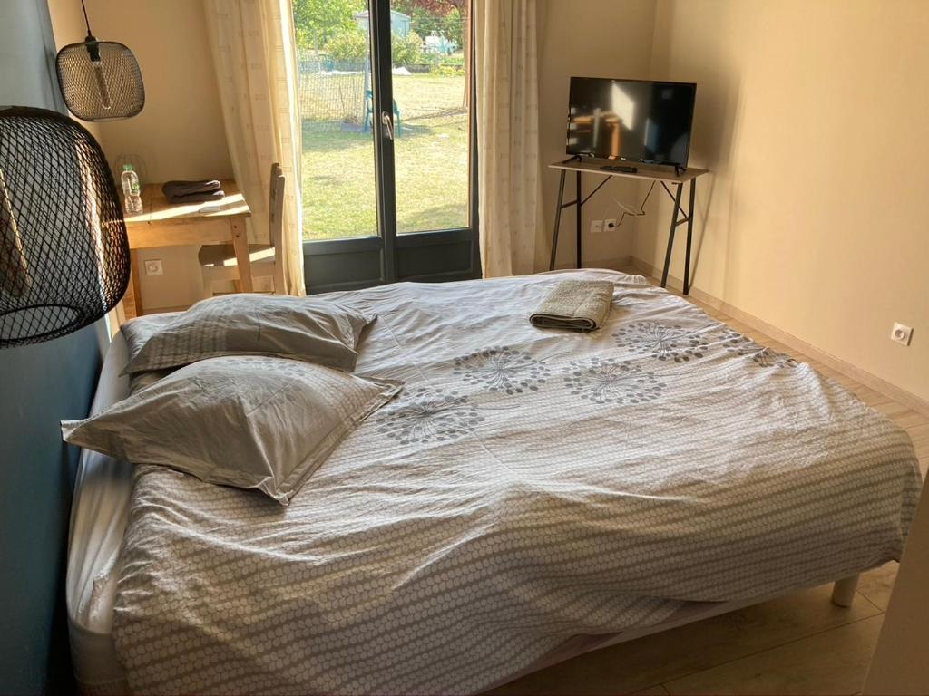 Postel nebo postele na pokoji v ubytování Chambre au calme