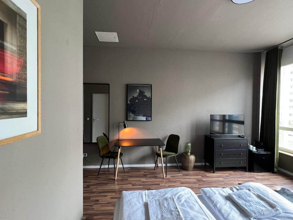 Postel nebo postele na pokoji v ubytování N8 ROOMS - by Leipzig Suites