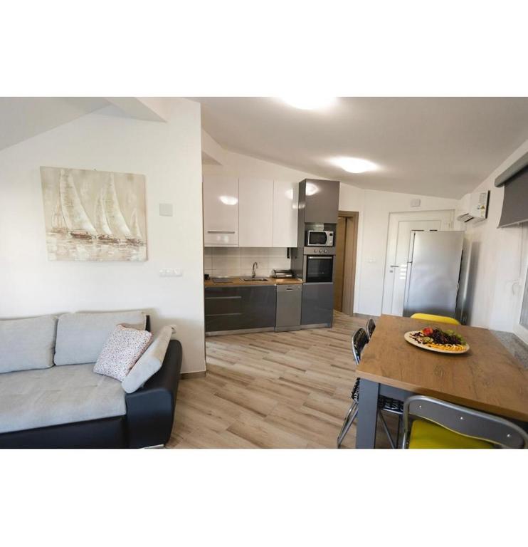 Kuchyň nebo kuchyňský kout v ubytování Apartmani Jedro