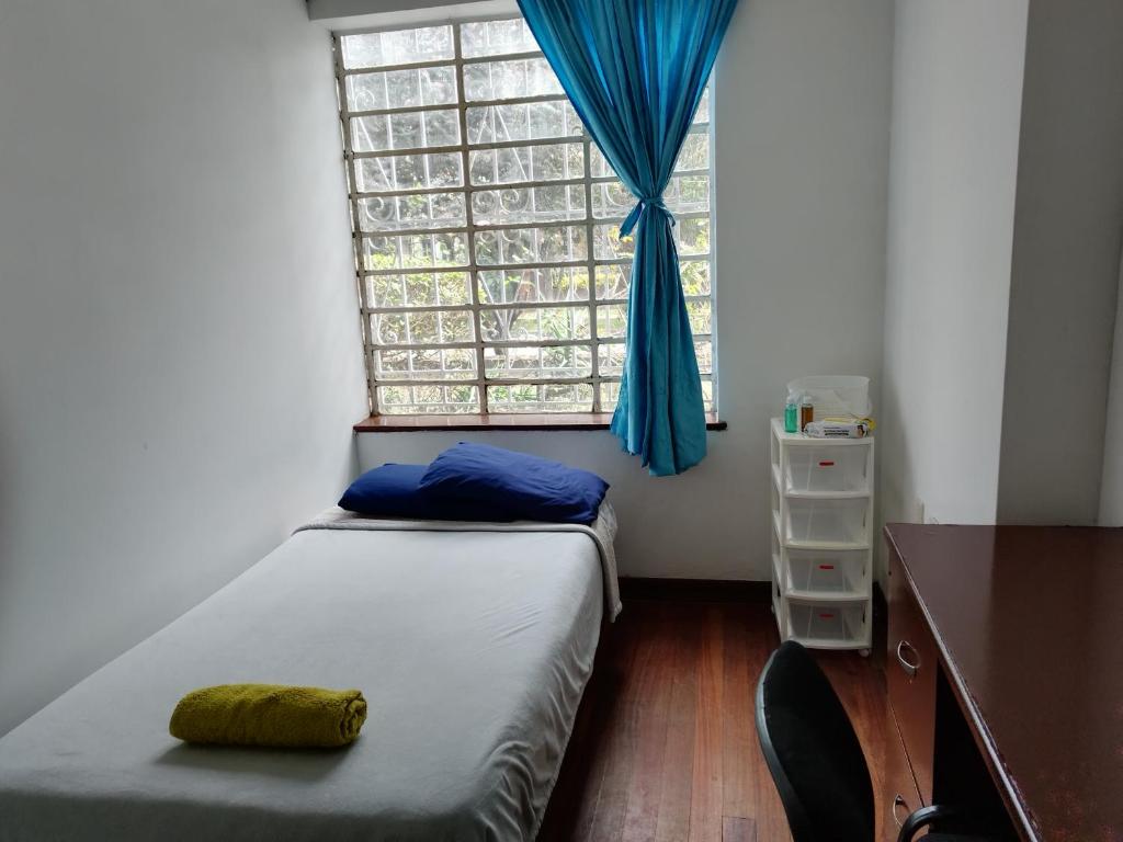Postel nebo postele na pokoji v ubytování Casa en Bogotá ubicada en zona central