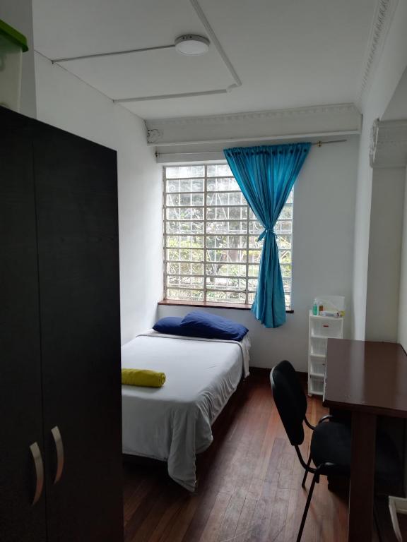 Postel nebo postele na pokoji v ubytování Casa en Bogotá ubicada en zona central