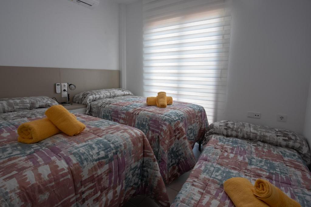 A bed or beds in a room at Holiday beach Gran Alacant