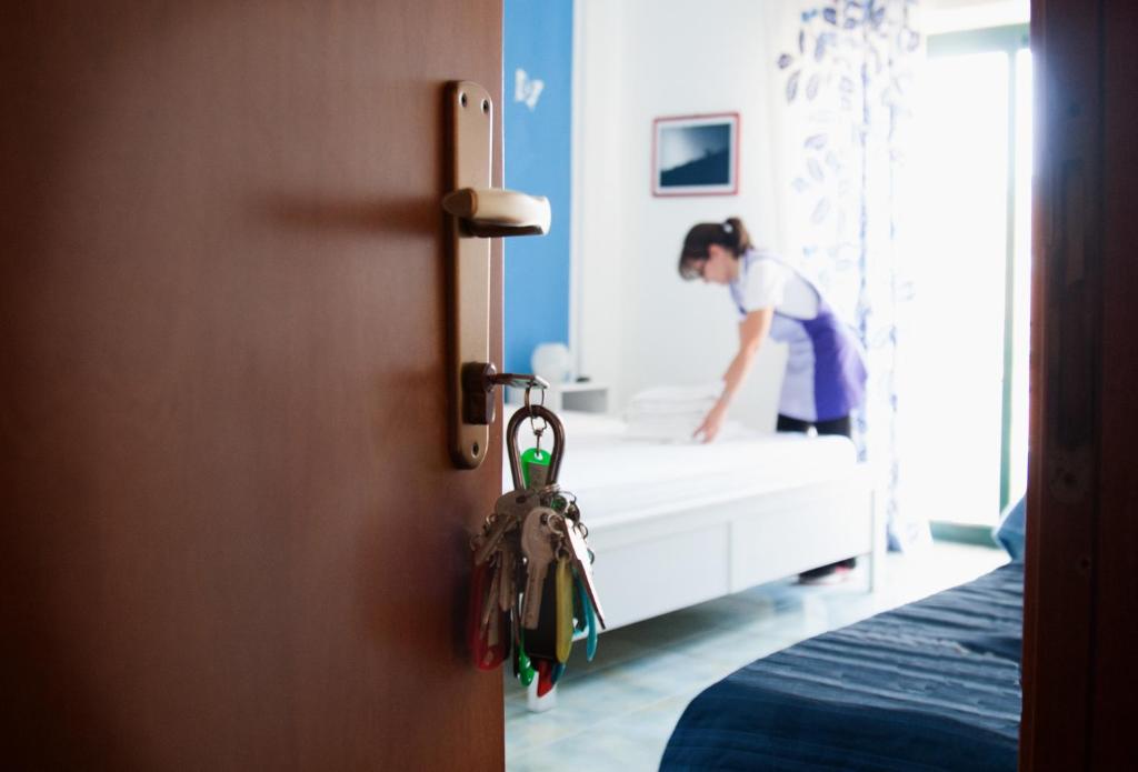 Postel nebo postele na pokoji v ubytování Hotel Donna Rosa
