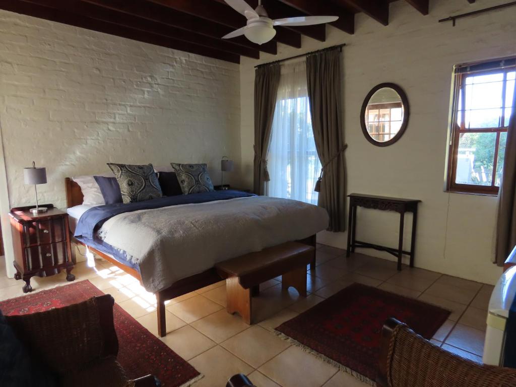 a bedroom with a king sized bed in a room at Belle View Guest Suite in Hermanus